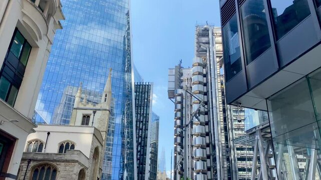 London pan through City Square Mile Financial District gleaming skyscrapers