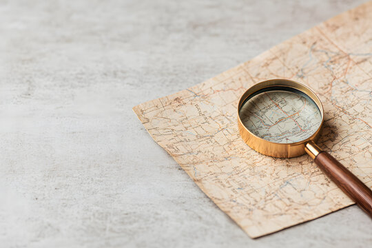 Map and Magnifying Glass for Journey Planning | Exploring Destinations and Navigating Your Next Adventure