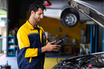 Battery inspection. Battery Capacity Tester Voltmeter. Hispanic latin man professional mechanic...