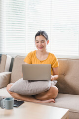 Fototapeta premium Young businesswoman working from home with laptop and documents. Work life balance concept