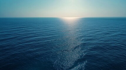 Obraz premium Aerial View of the Open Sea with Subtle Wave Patterns