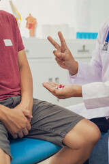 A male doctor examines a patient for an enlarged prostate, a common issue in male sexual health....