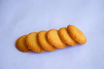 Danish butter cookies, stack of golden chocolate butter cookies isolated on white background, sweet pastry
