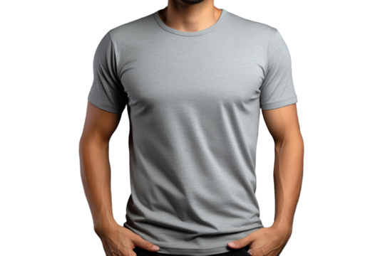 A confident man stands with his hands on his hips, wearing a gray t-shirt that highlights a simple and modern aesthetic in a clean background. - Powered by Adobe
