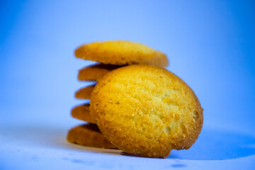 Danish butter cookies, stack of golden chocolate butter cookies isolated on white background, sweet pastry