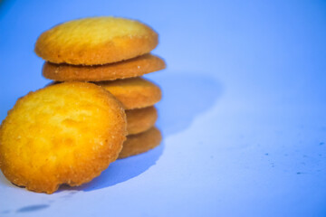 Danish butter cookies, stack of golden chocolate butter cookies isolated on white background, sweet pastry