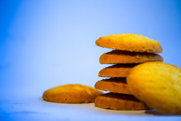 Danish butter cookies, stack of golden chocolate butter cookies isolated on white background, sweet pastry