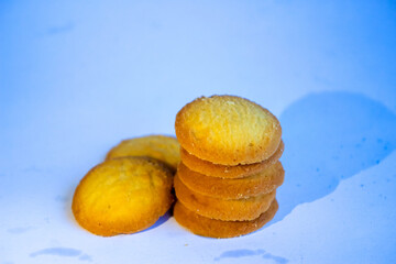 Danish butter cookies, stack of golden chocolate butter cookies isolated on white background, sweet pastry
