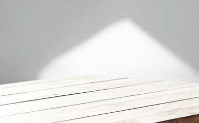 Minimal table for product display, light background.