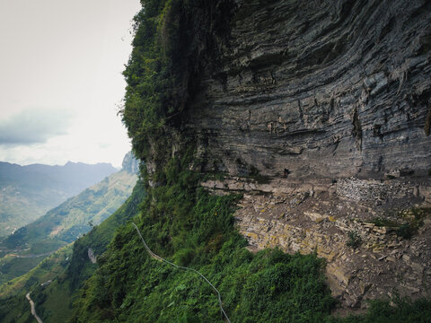 Aerial photography of white cliffs in Ha Giang, Vietnam, overseeing the gorge that marks the frontier with China