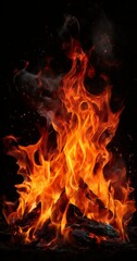 A vibrant fire burns with intense flames and sparks, casting a dramatic glow against a dark background.