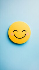 Fototapeta premium a smile emoticon from paper on soft color background