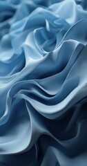 Obraz premium a close-up view of a fabric with a flowing, wavy texture in shades of blue, creating a sense of movement and depth.