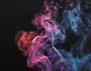 Obraz premium Vibrant smoke swirls and dances against a dark backdrop, creating a mesmerizing display of colors and patterns.