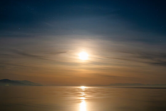 moonrise over mountain lake at night, Sevan in Armenia