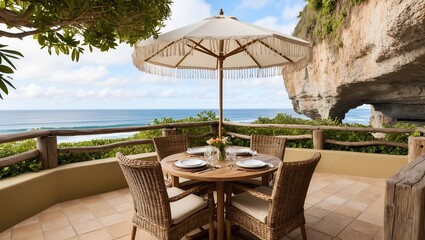 Obraz premium outdoor dining setup on a cliffside terrace overlooking the ocean.