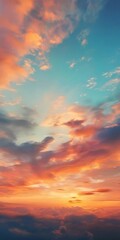 Fototapeta premium A breathtaking sunset scene with vibrant orange and blue hues, dramatic cloud formations, and a warm, golden glow illuminating the sky.