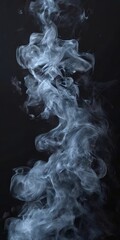 Fototapeta premium Abstract smoke swirls against a dark background, creating a sense of movement and mystery.