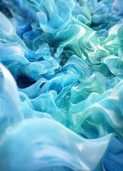 Obraz premium a close-up of a swirling, abstract pattern of blue and green hues, resembling the movement of water or a sea of clouds.