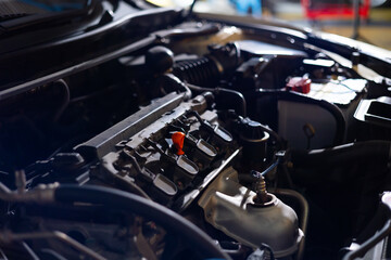 Fototapeta premium under car hood. Motor engine background banner. parts and open hood