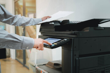 Hand use copier or photocopier or photocopy machine office equipment workplace for scanner or scanning document or printer for printing paperwork hard copy duplicate Xerox service maintenance repair.