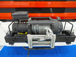 Winch on truck bumper. Winch with strong steel cable. Equipment for evacuation cars. Industrial...