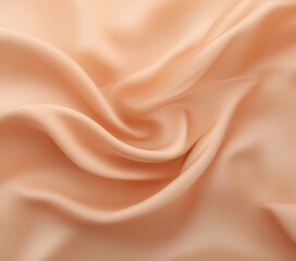 Obraz premium a close-up view of a soft, flowing fabric with a peach-colored hue, exhibiting a smooth and silky texture.