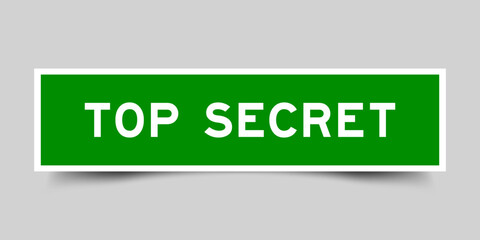 Square sticker label with word top secret in green color on gray background