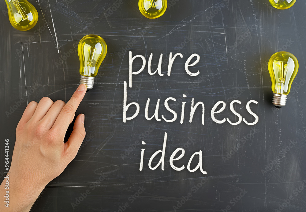 Poster pure business idea is written on a blackboard with a hand pointing to it. concept of importance and 