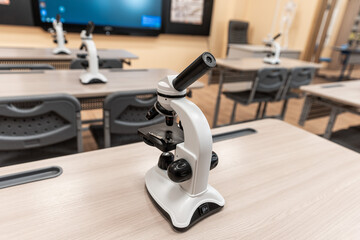 Biology or chemistry classroom at school, classroom with microscopes on desks. Interior of the classroom.