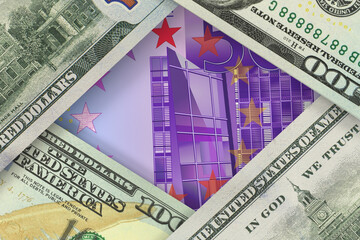 Banknote of the single European currency EURO peeks out from under US dollar bills. Currency...