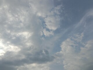 Every cloud has a silver ling. Hope concept. Blue
sky with sunlight through grey clouds.