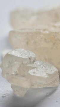 Vertical Video 4k. World Drug Day. World AIDS Day. crystal mephedrone designer drugs, bath salt on white background. 2024
