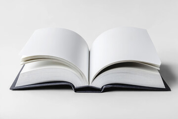 Fototapeta premium An open book with blank pages isolated on a clean white background.