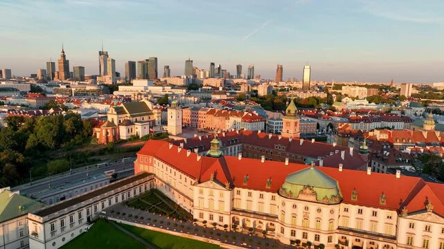 Aerial view of the Warszawa cityscape. Old town and modern skyscrapers at sunrise, Royal Castle. Poland.