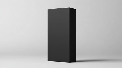 A simple, black rectangular packaging box mockup, standing vertically on a light grey background