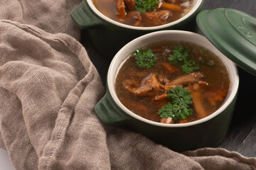 Soup with chanterelle mushrooms close up