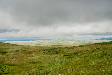 Clouds Hang Low Over The Swooping HIlls Of The Mary Mountain Trail