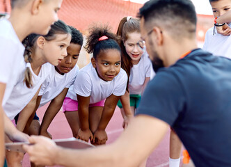 child sport athlete competition running coach teamwork exercise kid fitness training athletic young active girl game group play team childhood school action exercising