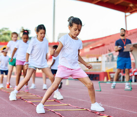 Fototapeta premium child sport athlete childhood girl competition fun young outdoor active exercise kid running fitness training athletic game healthy group play team school exercising jump