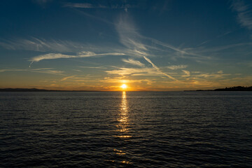 sunset over lake constance ( Bodensee )  with blue sky and clouds but clear sight in lindau, germany