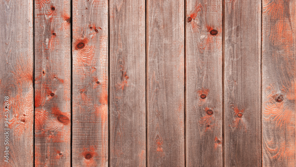 Aufkleber a wooden background with red paint on it. the red paint is splattered all over the wood, giving it a