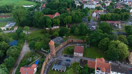 A view of Trzebiatów’s medieval center, featuring the towering red-brick Gothic church...