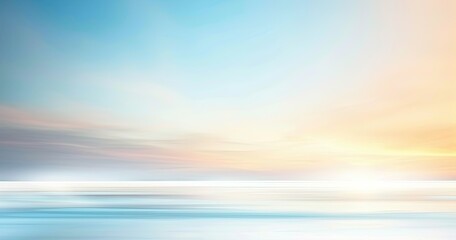 Obraz premium A serene landscape featuring a soft gradient of blue, orange, and pink hues, evoking tranquility and calmness.