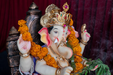 A Closeup shot Ganpati Installed in a Pandal during the 10 Day Ganesh Festival, the idols are immersed in heavy water bodies after the 10 days.