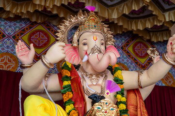 A Closeup shot Ganpati Installed in a Pandal during the 10 Day Ganesh Festival, the idols are immersed in heavy water bodies after the 10 days.