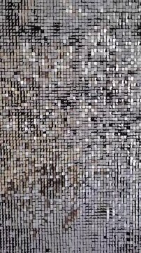 abstract background - shiny kinetic surface. Mirror sequins sway by wind blowing.