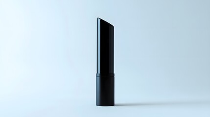 Obraz premium Matte Lipstick Tube: A matte black lipstick tube standing upright on a white background, with minimal reflections and clean lines. 