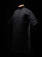 Historical fashion. Medieval knight cloth. Padded jacket gambeson.