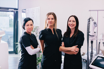 Team of women beauticians or aesthetic medicine professionals at work portrait in a clinic or...